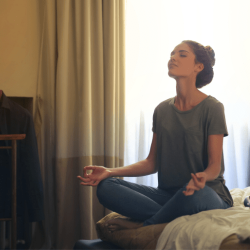 woman meditating in seated lotus position